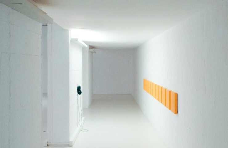 empty hallway between white walls